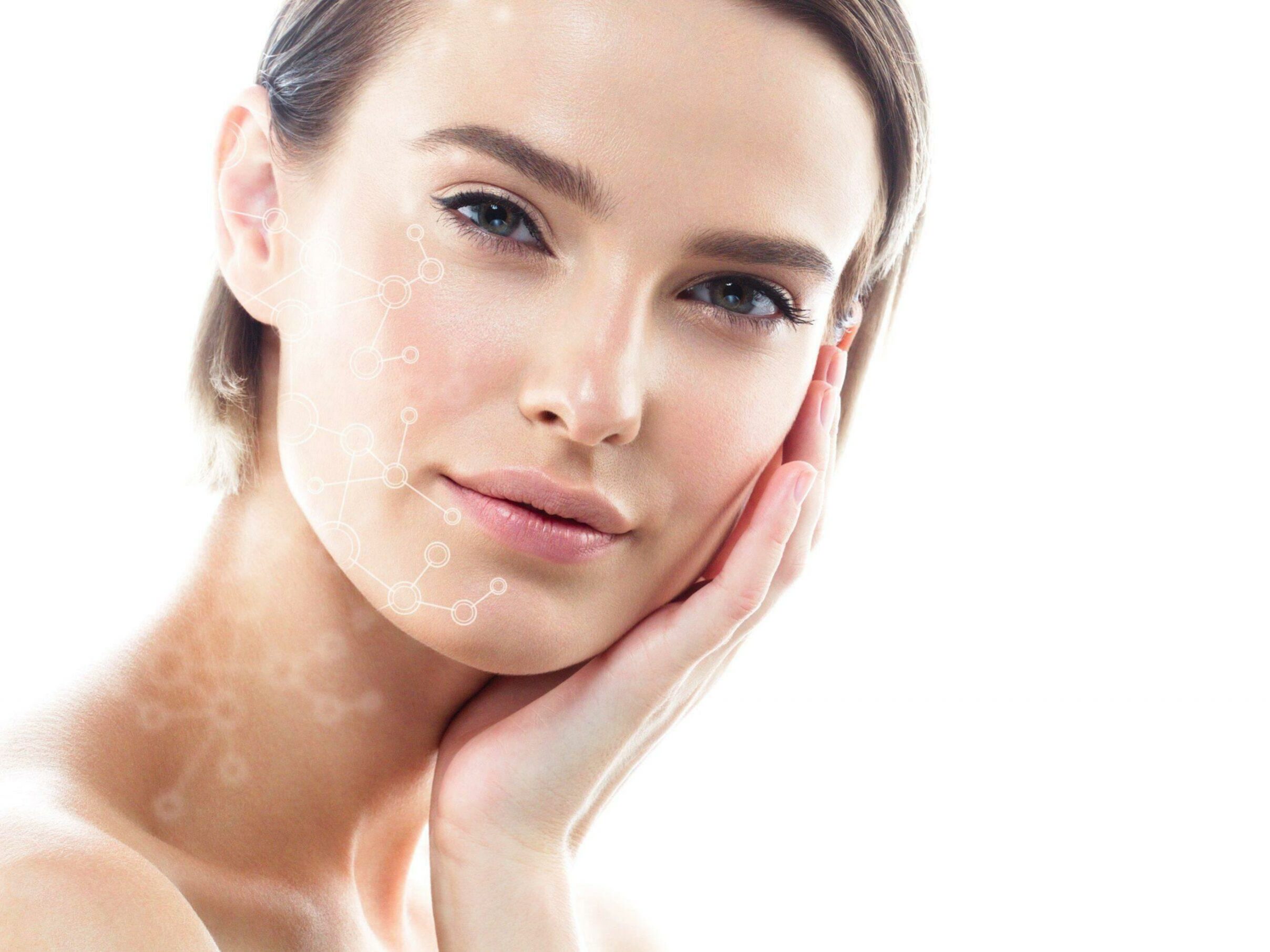 perfect_microbiome A woman with clear skin gently touching her face with one hand, looking directly at the camera. A subtle overlay of molecular structures is superimposed on her cheek, suggesting a focus on skincare or beauty technology. The background is white and minimalistic.