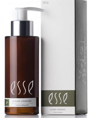 A brown pump bottle labeled "Esse Cream Cleanser" is placed next to its matching white and green box. Both the bottle and the box feature the same "Esse" branding, clearly indicating that the product inside is a cream cleanser.