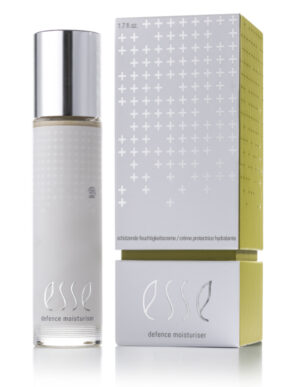 A bottle of Esse Defence Moisturiser with a silver cap sits beside its coordinating silver and yellow box, both featuring minimalist modern design and the product name in lowercase letters.