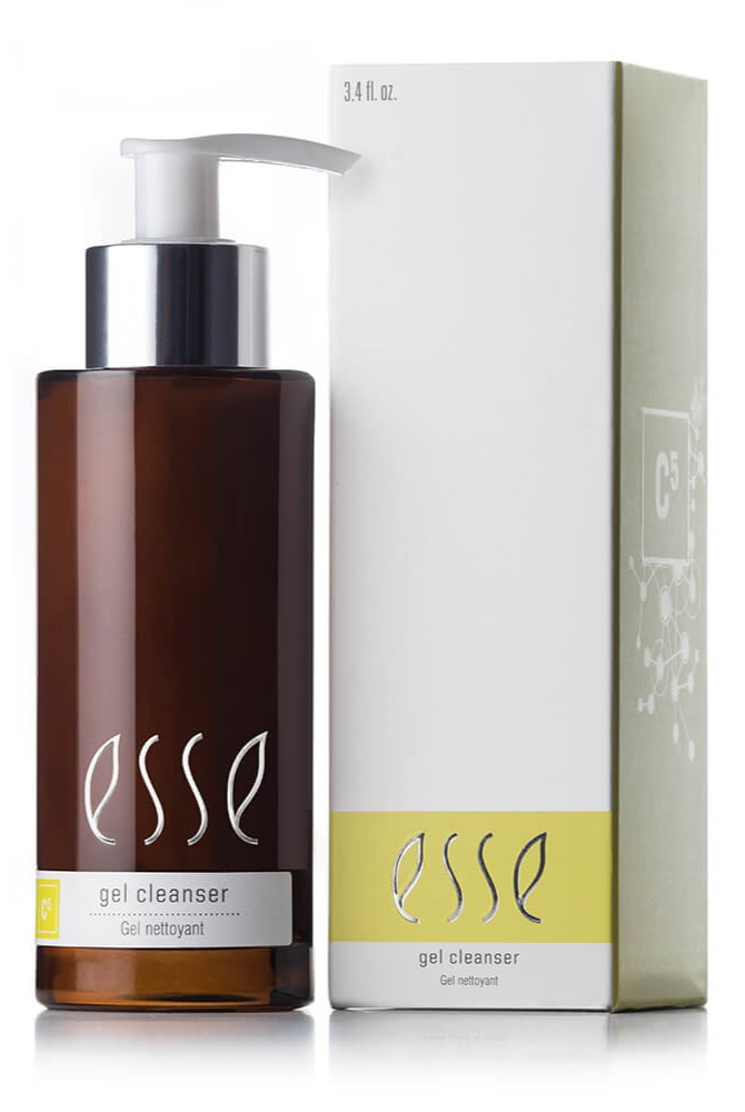 A 3.4 fluid ounce (100 milliliter) brown pump bottle labeled "Esse Gel Cleanser" stands next to its light-colored box packaging, which displays the same "Esse" branding and product details in white and lime green.
