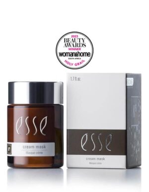 Image of the Award-Winning Esse Cream Mask, a skincare product in a brown jar with a silver cap, placed next to its white and grey box packaging. An award seal above proudly displays "Beauty Awards Winner 2023" by Woman & Home South Africa with "Holy Grail" mentioned below.