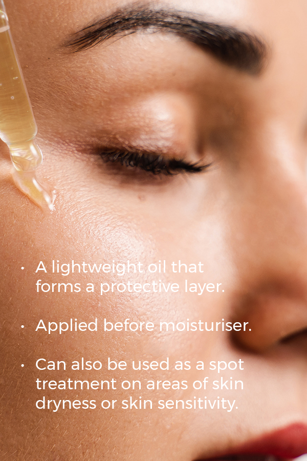 Close-up of a woman with eyes closed, applying a drop of oil to her cheek. Text on the image reads: "Esse Protect Oil: a lightweight oil that forms a protective layer. Applied before moisturizer. Can also be used as a spot treatment on areas of skin dryness or sensitivity.