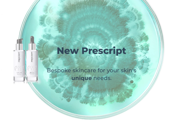 A marketing image featuring two bottles of "Prescript" skincare product on the left and a blue-green circular abstract design in the background. Text reads, "New Prescript - Bespoke skincare for your skin's unique needs.