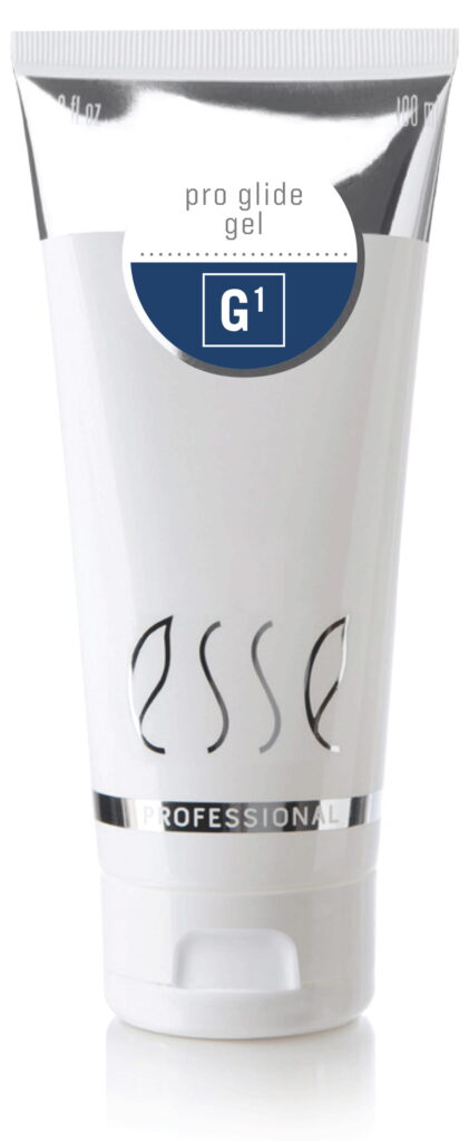 A white tube labeled "esse PROFESSIONAL" with a blue and white sticker reading "pro glide gel G1" near the top. The cap is at the bottom, and the overall design is minimalistic and sleek.