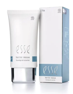 A white tube labeled “Esse Barrier Rescue” stands next to its matching box, both featuring minimalist blue and silver accents. The product volume is 2.7 fl oz.